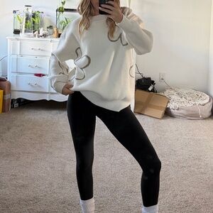 White knit sweater with flower designs